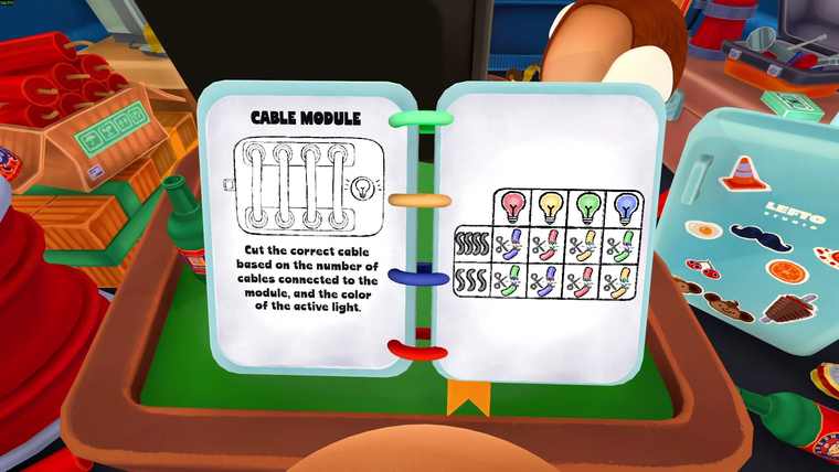 An open ring-bound manual on a green table showing the Cable Module page with a wiring diagram and a colour table